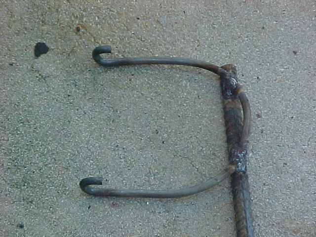 I welded a piece of 3/4 rebar to the hooks to make a handle